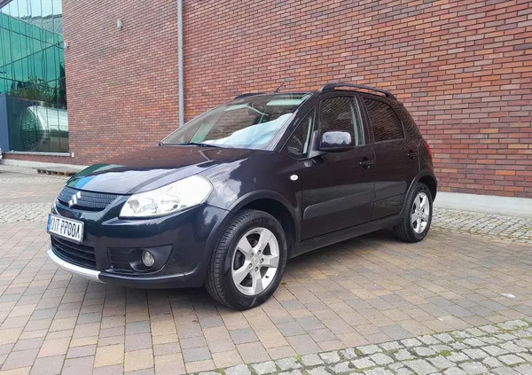 małopolskie Suzuki SX4 cena 29900 przebieg: 150000, rok produkcji 2009 z Racibórz